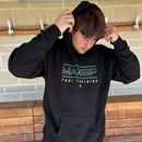 Person wearing a black hoodie with 'MAXBP' branding outdoors.